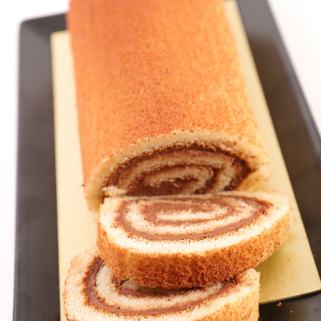 Chestnut and blackcurrant Yule log decorated with candied chestnuts