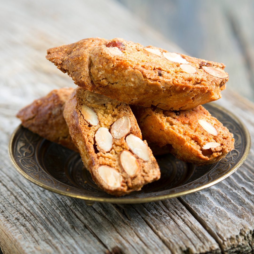 Golden almond croquants, sliced and stacked on a plate